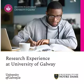 Research Experience at University of Galway brochure image. A focused young Black man in a grey hoodie and glasses writes in a notebook at a desk with an open book, laptop, and coffee cup.